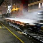 image: snowy goods train passes