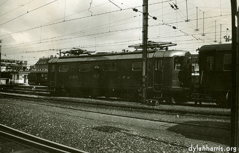 image: New Type Express Loco. Type Re 4/4. 15kV. Built by Oerlikon. At Zurich Station. Similar to those used on Zurich-Basle Route. Photograph by Ray Burrows. 15 August 1948.