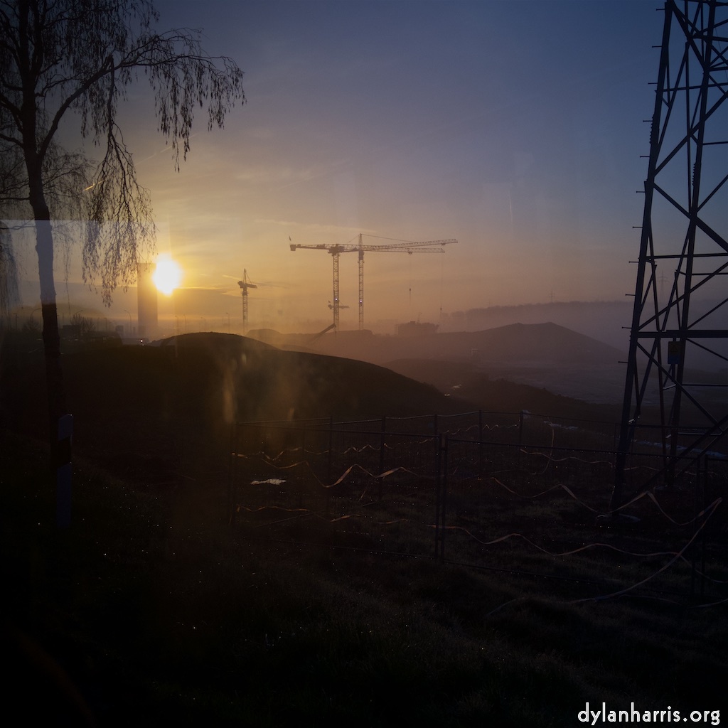 An early morning shot, into the sun, showing the building site that is to be the new National Stadium.