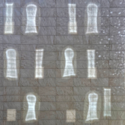 image: reflections of sunlit windows on a sheet