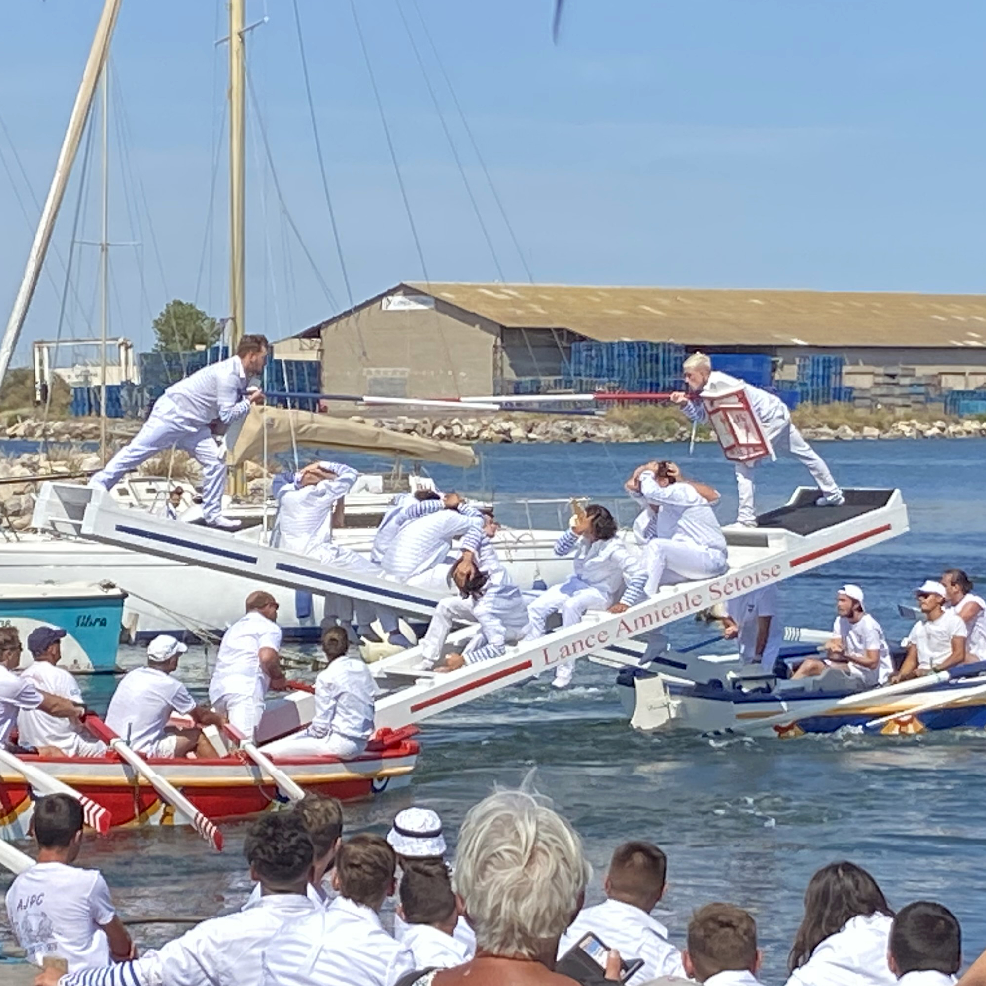 two mad men in two mad boats joust over water