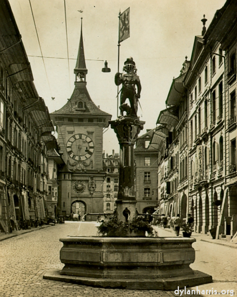 image: Postcard [[ The Famous Clock Tower of Bern and the Zaehunger Fountain. ]]