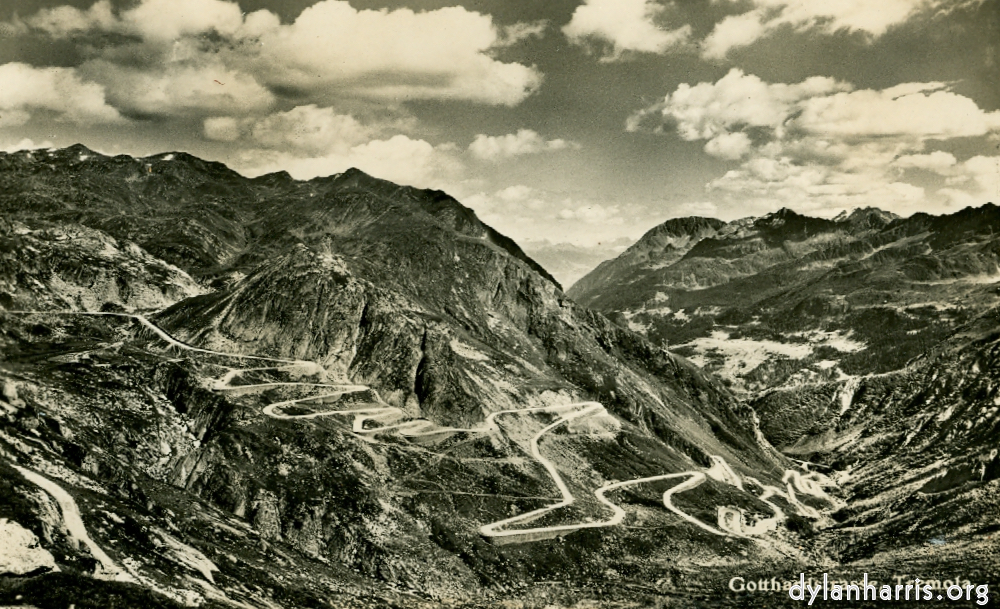 image: Postcard: Gotthardstrasse, Tremola. [[ With Airolo just visible at the feet of the Valley. ]]