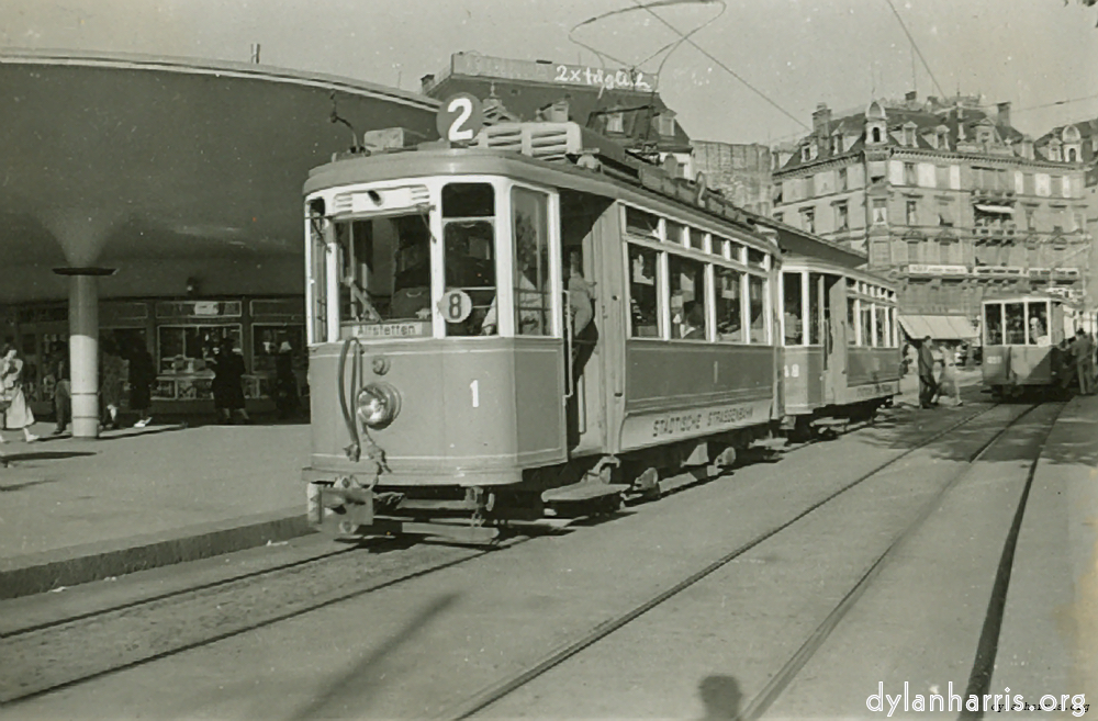 image: Zürich Tram en Trailer (Old Type). Bellevue, Zürich. Photograph by Ray Burrows. 21 August 1948