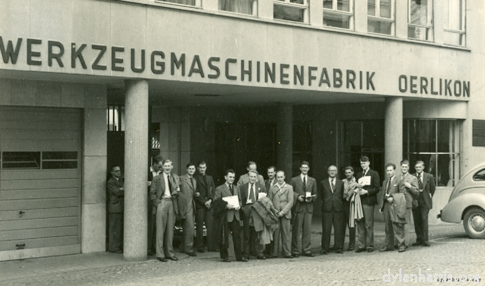 image: Some of the I.E.E. Party. At the main entrance to Werkzeugmaschinenfabrik Oerlikon Buhle & Co. Oerlikon. Zürich. 19 August 1948.